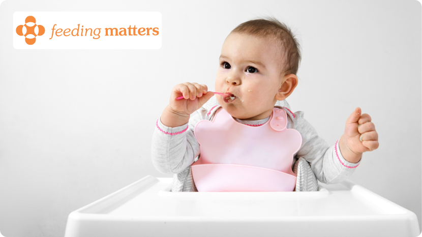 baby led feeding, taking strawberry