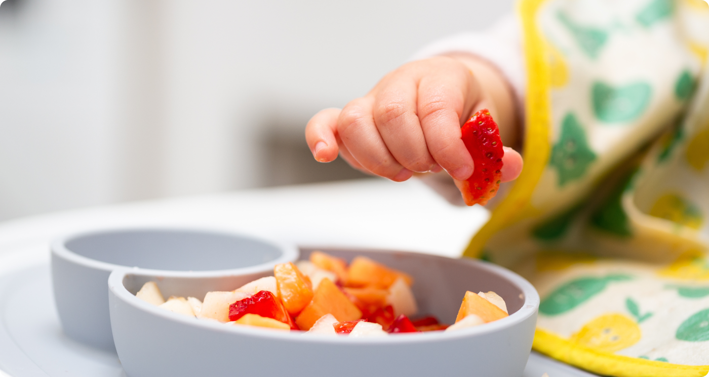 Baby eating by himself
