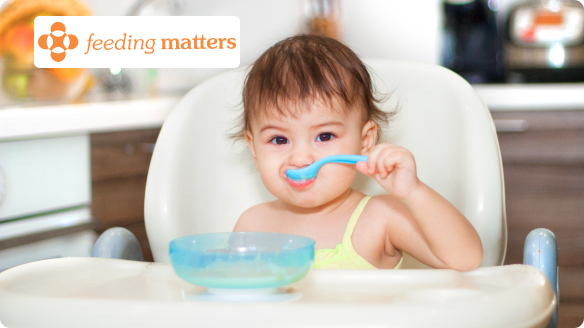baby eating from spoon