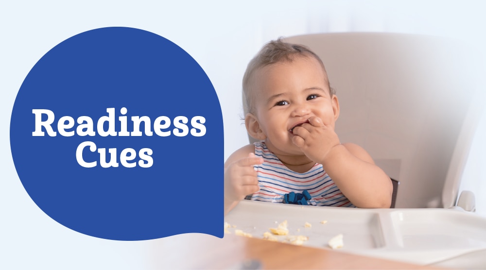 Baby eating in a high chair