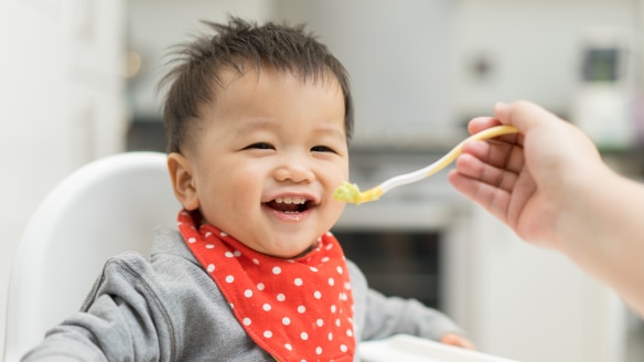 baby eating from spoon